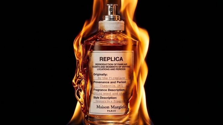 Maison Margiela Replica By the Fireplace Fireplace Firelight Eau de Toilette 100ml bottle displayed in a warm, cozy setting inspired by glowing fireplace flames, with a comforting atmosphere of smoky wood, roasted chestnut, and winter warmth.